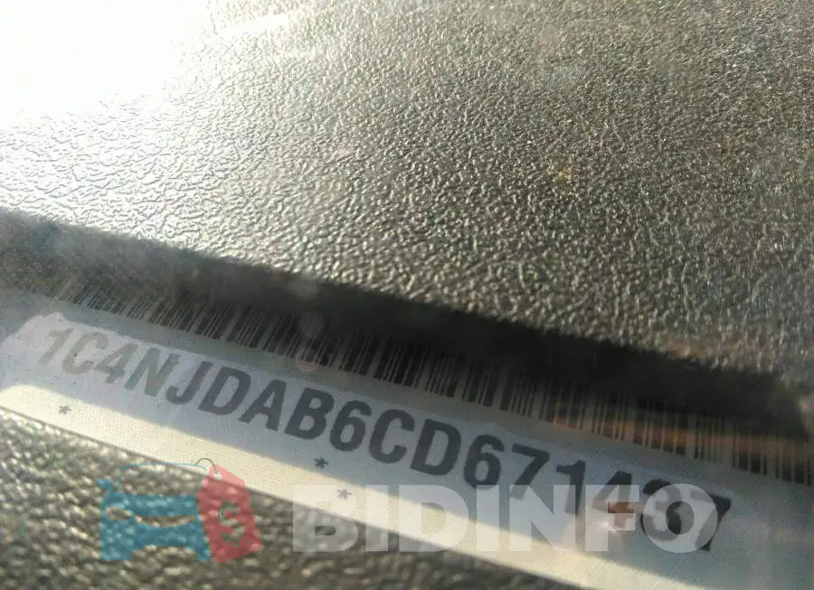 1C4NJDAB6CD671437 Photo# 9