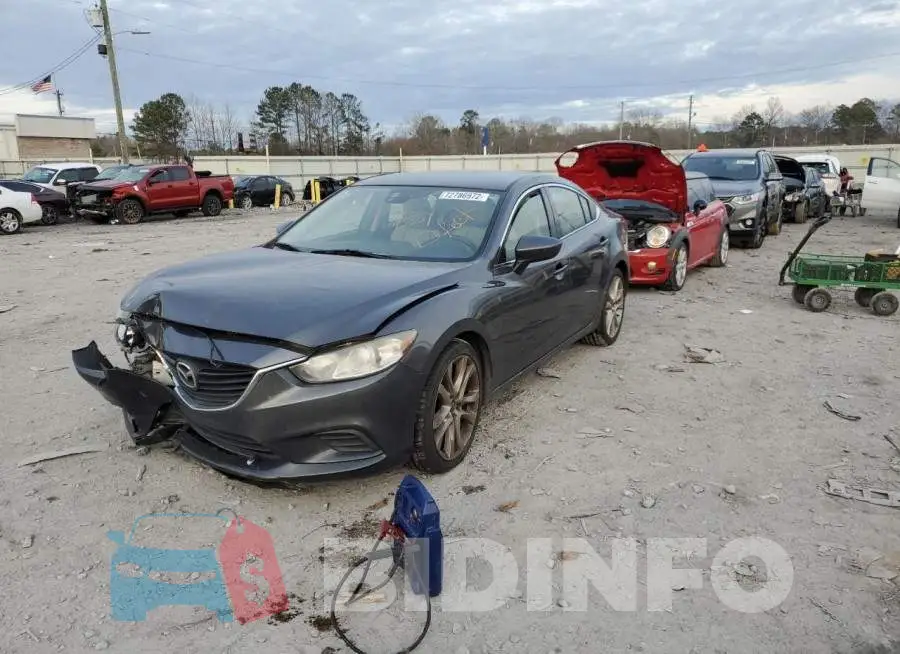 JM1GJ1T64E1153385 Photo# 1