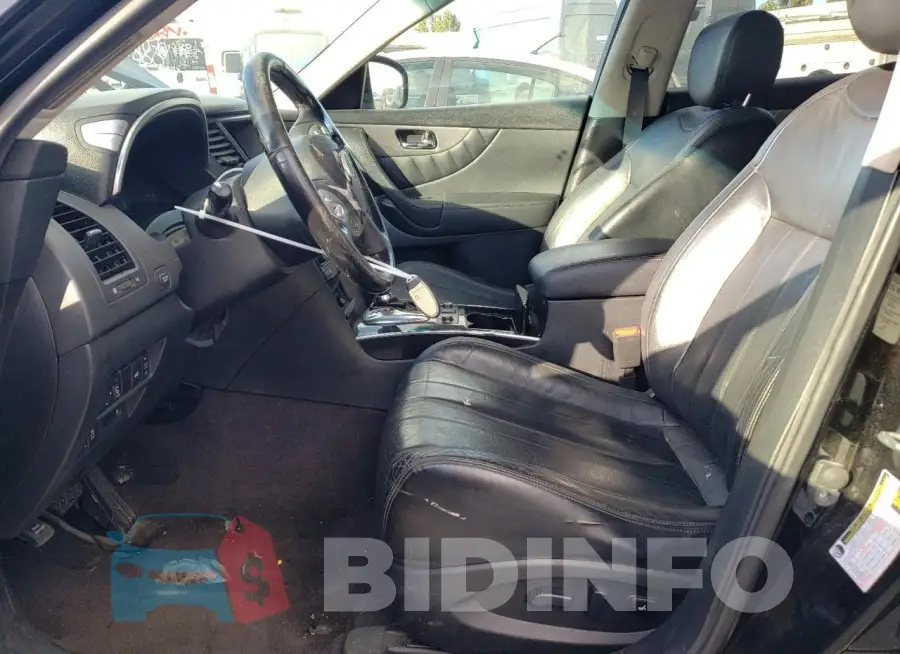 JN8CS1MU3FM381679 Photo# 7