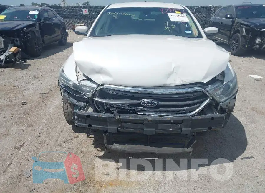 1FAHP2E88JG103111 Photo# 6